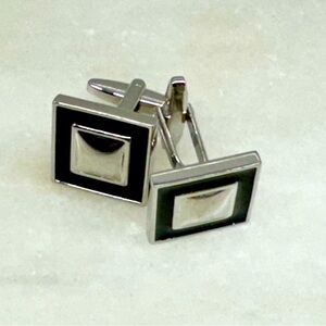 Silver and black enamel cufflinks.